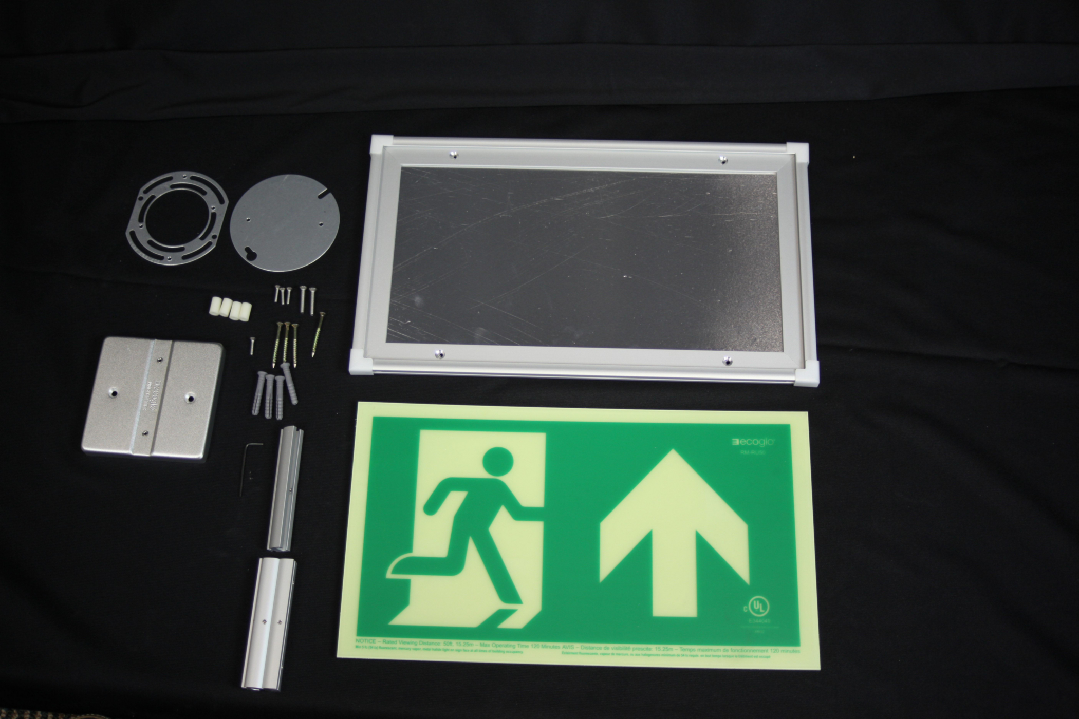 Product image for ECOGLO RM-RU50-CA EXIT SIGN PHOTOLUMINESCENT SINGLE SIDED RUNNING MAN WITH UP ARROW ALUM FRAME C/W MOUNTING KIT